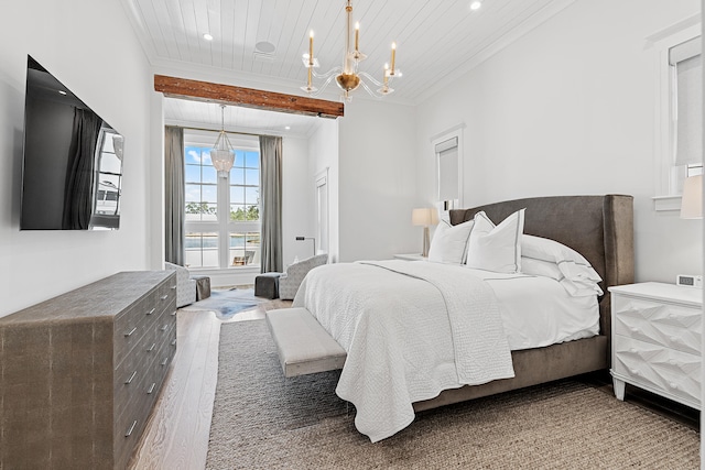 bedroom with ornamental molding, dark wood-type flooring, beamed ceiling, and a notable chandelier