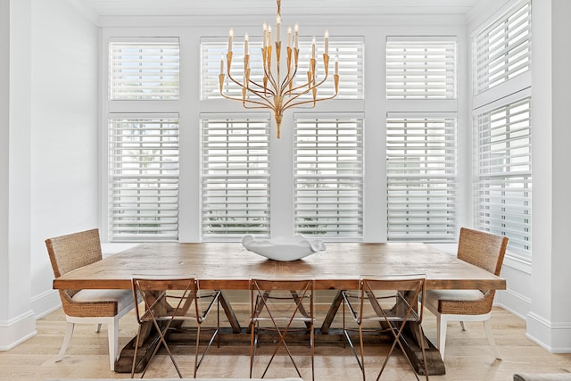 dining room featuring a notable chandelier and light hardwood / wood-style floors