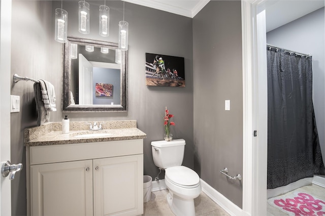 bathroom with vanity, crown molding, tile patterned floors, and toilet