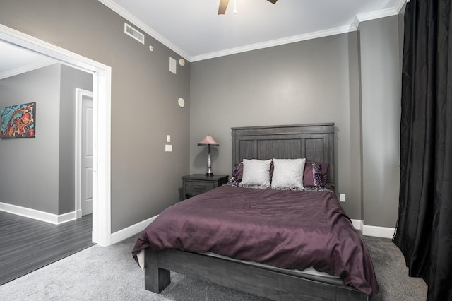 carpeted bedroom featuring crown molding and ceiling fan