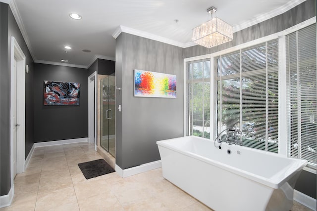 bathroom with tile patterned flooring, a notable chandelier, ornamental molding, and separate shower and tub