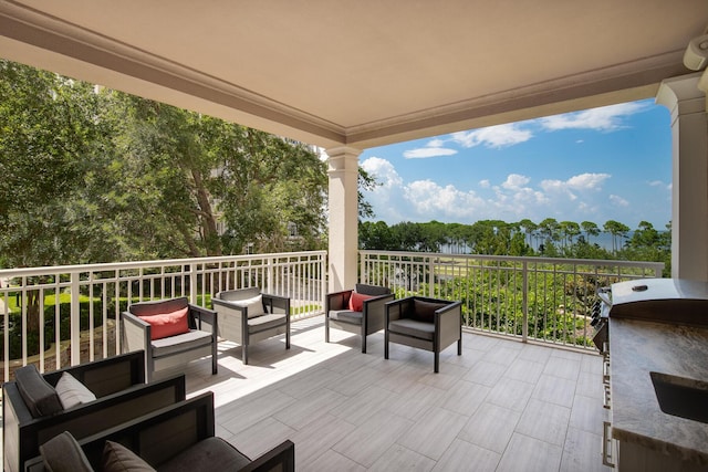 view of patio featuring a grill, an outdoor hangout area, and a balcony