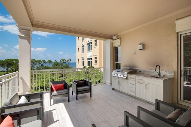 view of patio featuring area for grilling, sink, and exterior kitchen