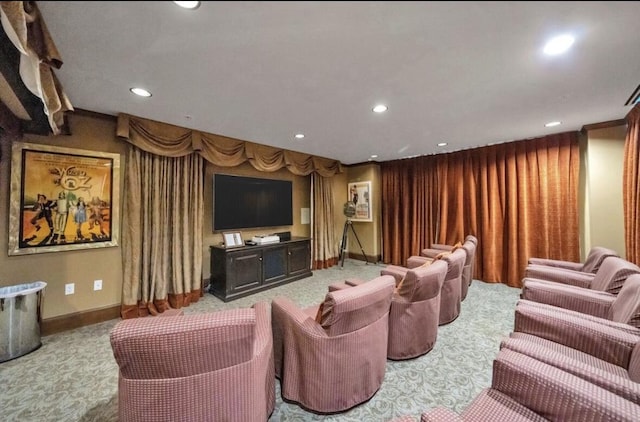 home theater room featuring light carpet