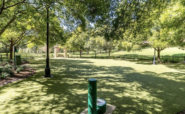 view of property's community featuring a yard