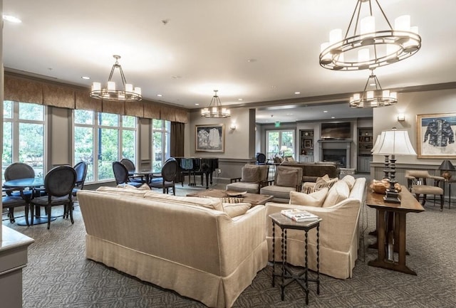 carpeted living room featuring a notable chandelier and built in features