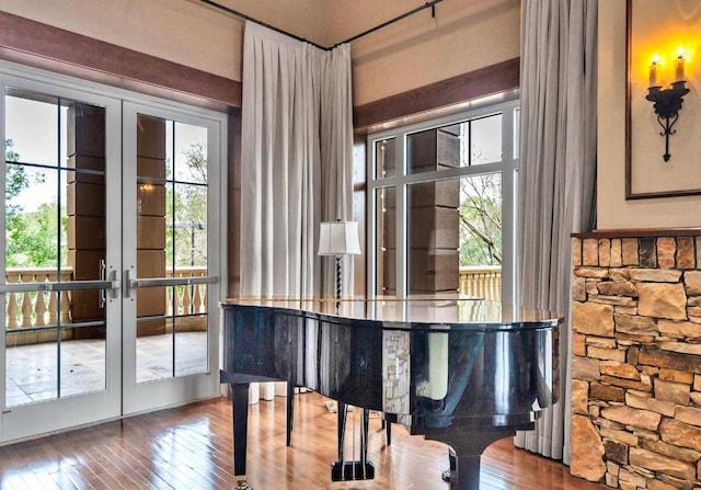 miscellaneous room featuring hardwood / wood-style floors and french doors