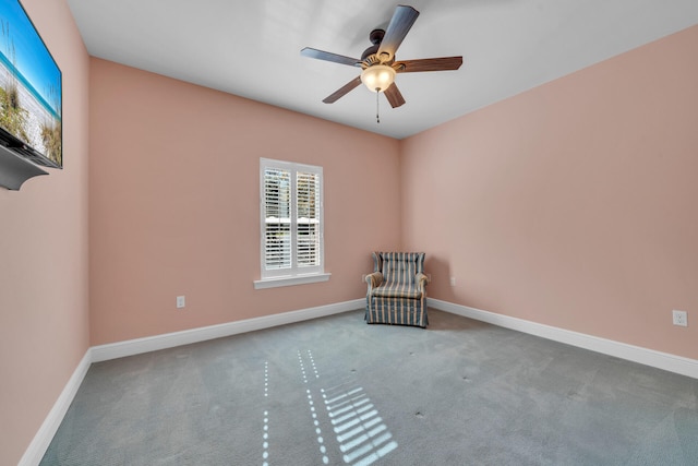 unfurnished room featuring ceiling fan and light colored carpet