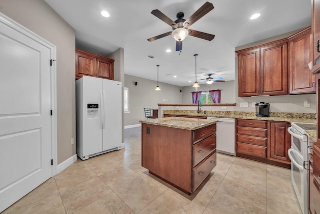 kitchen featuring ceiling fan, a center island, pendant lighting, white appliances, and light tile patterned floors