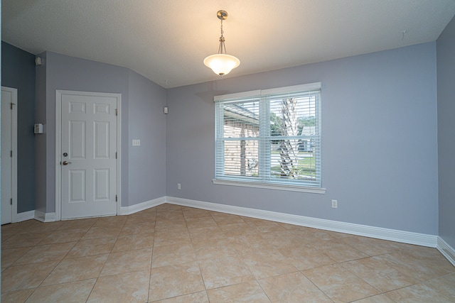 empty room featuring light tile flooring