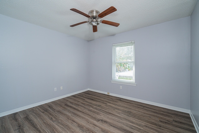 unfurnished room featuring dark hardwood / wood-style floors, ceiling fan, and a textured ceiling