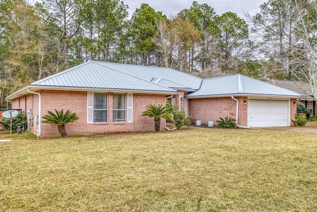 ranch-style home featuring a garage and a front lawn