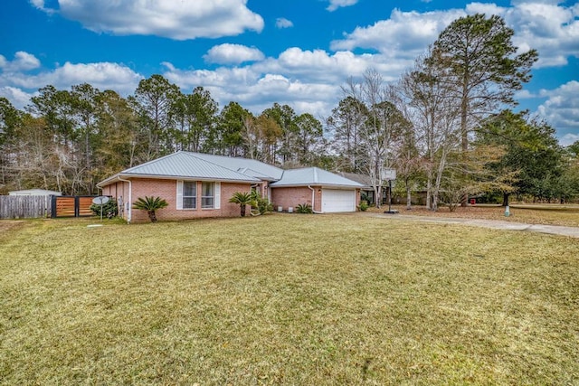 view of front facade with a garage and a front lawn