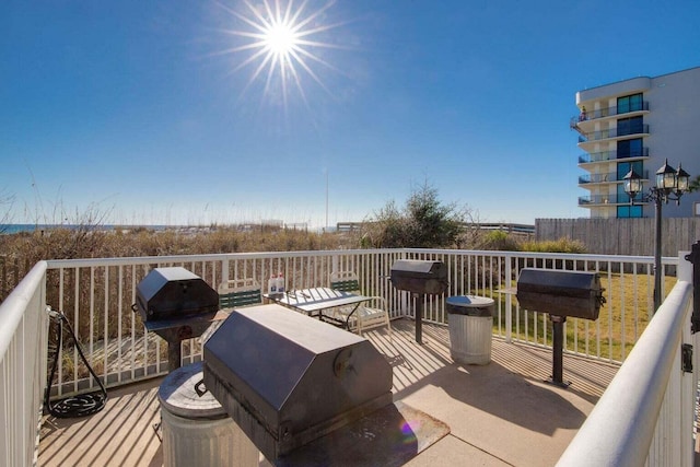 wooden deck featuring area for grilling