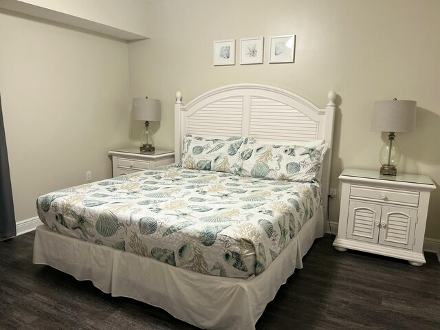 bedroom featuring dark hardwood / wood-style flooring