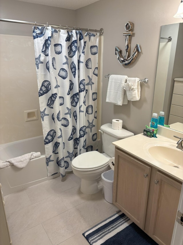 full bathroom with tile patterned floors, vanity, toilet, and shower / bath combo