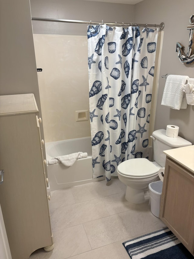 full bathroom featuring tile patterned flooring, shower / bath combination with curtain, vanity, and toilet