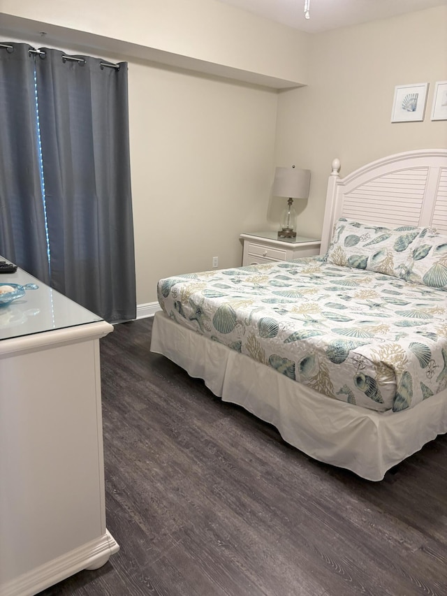 bedroom featuring dark wood-type flooring