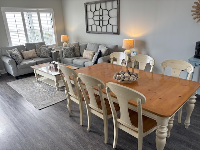 dining area with dark hardwood / wood-style floors