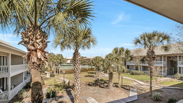 view of yard with a balcony