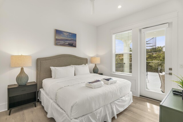 bedroom with light hardwood / wood-style flooring and access to outside