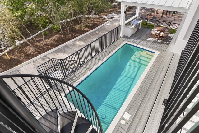 view of swimming pool with a patio area