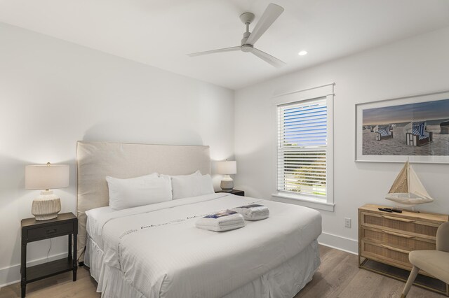 bedroom with hardwood / wood-style flooring and ceiling fan