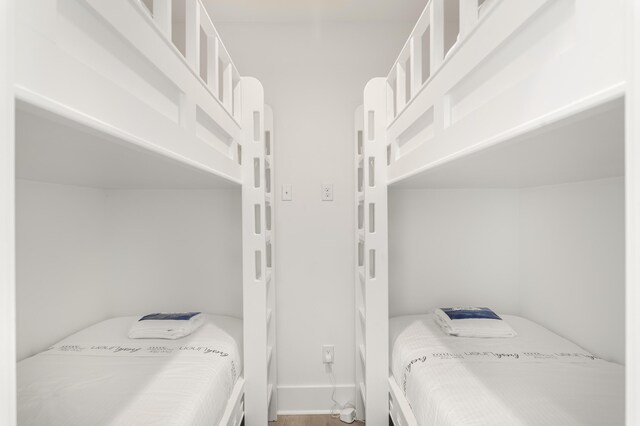 bedroom with wood-type flooring