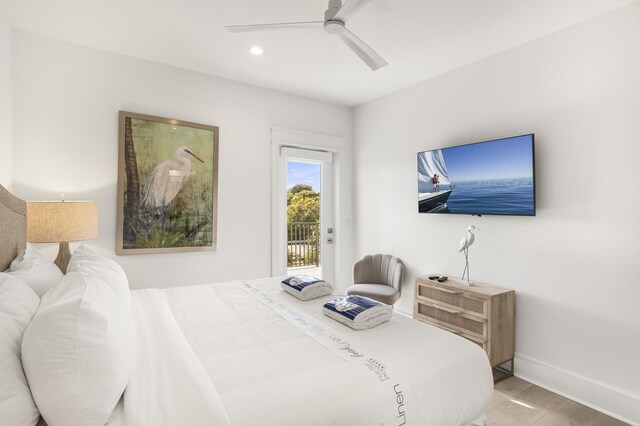 bedroom featuring ceiling fan, wood-type flooring, and access to exterior