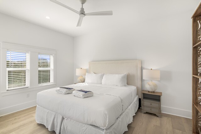 bedroom featuring ceiling fan and light hardwood / wood-style flooring