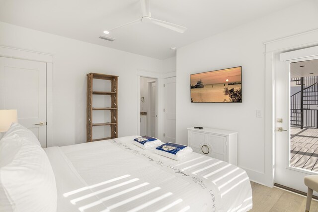 bedroom with light hardwood / wood-style floors and ceiling fan