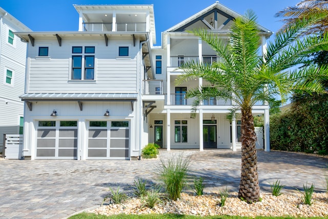 view of front of house featuring a balcony and a garage