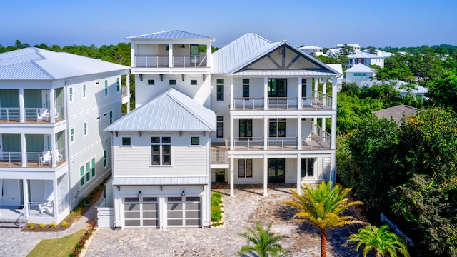 view of front of property with a garage and a balcony