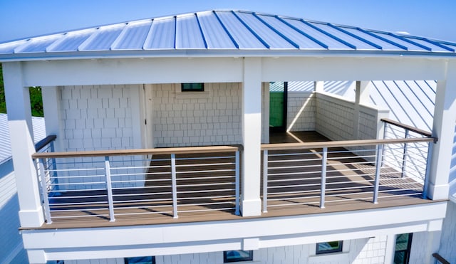 view of side of home featuring a balcony and a gazebo