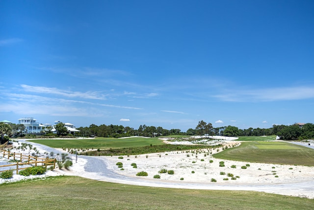 view of property's community with a yard