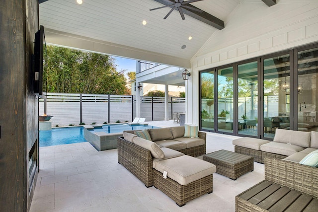 sunroom / solarium featuring ceiling fan and vaulted ceiling with beams