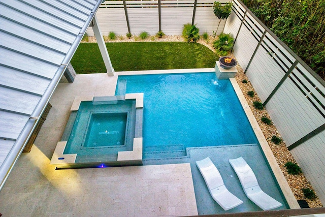 view of swimming pool featuring a lawn