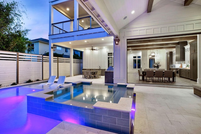 view of swimming pool with an outdoor living space, ceiling fan, an in ground hot tub, and a patio