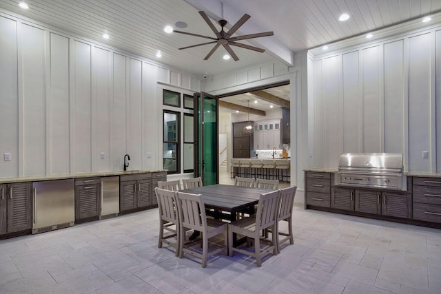 tiled dining room with beam ceiling and ceiling fan