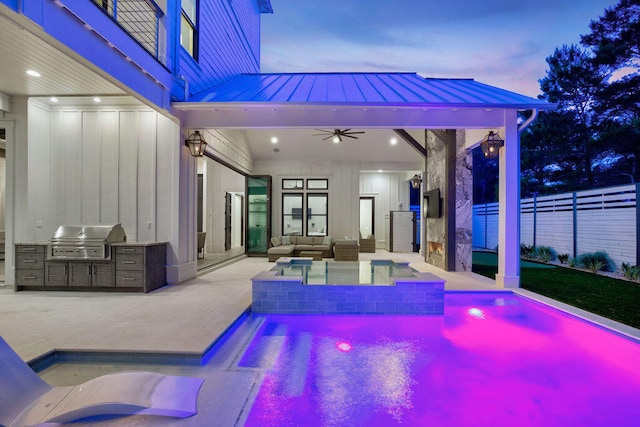 pool at dusk with a patio, ceiling fan, and a grill