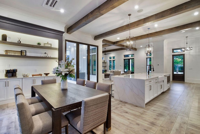 dining area featuring beamed ceiling, french doors, light hardwood / wood-style flooring, sink, and a notable chandelier