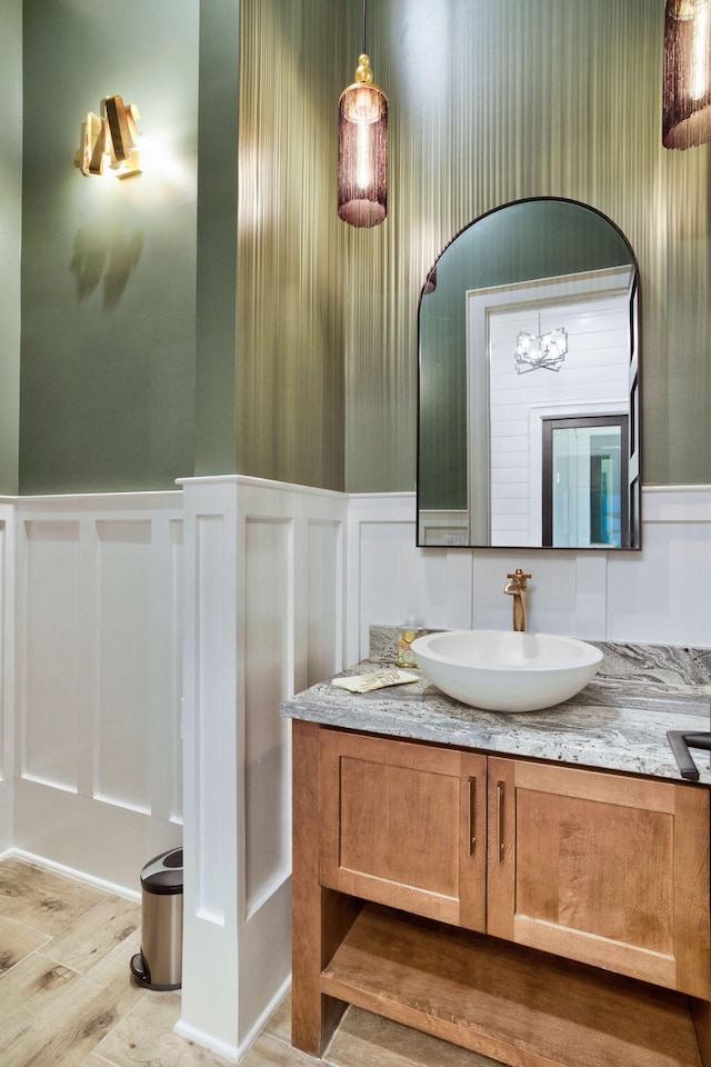 bathroom with wood-type flooring and vanity