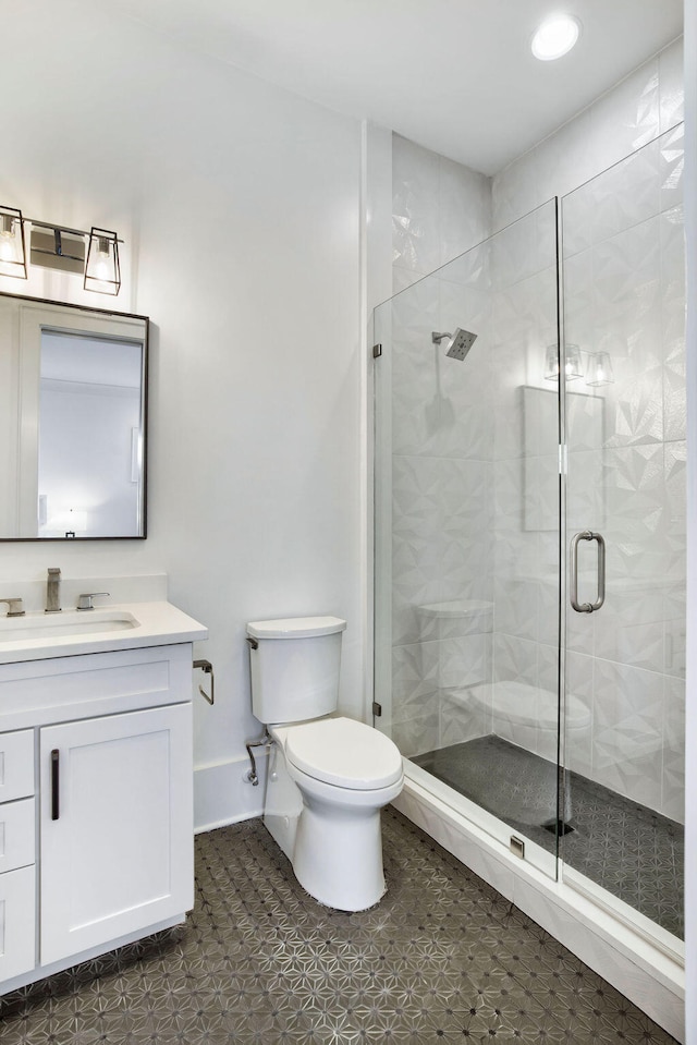 bathroom featuring tile flooring, walk in shower, vanity, and toilet