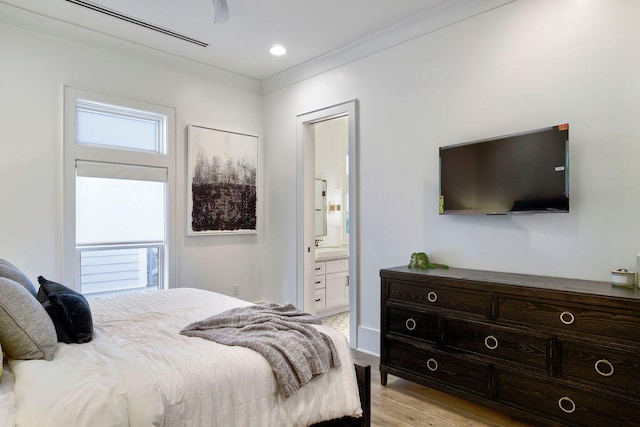 bedroom with light hardwood / wood-style flooring, connected bathroom, and ceiling fan