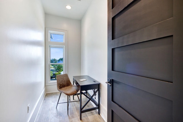 office space with light hardwood / wood-style floors