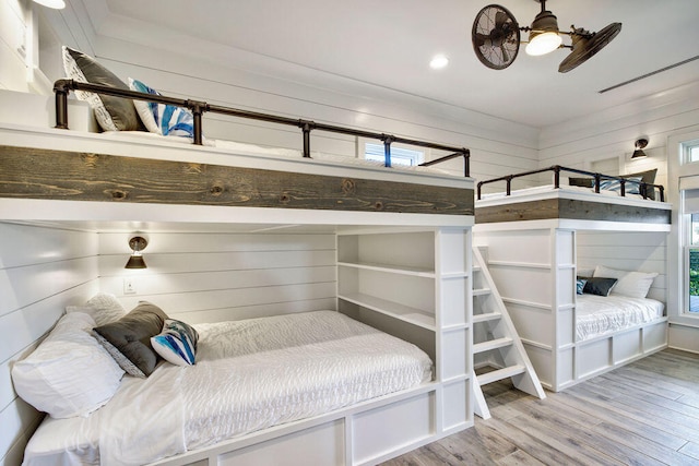 bedroom featuring multiple windows and light wood-type flooring