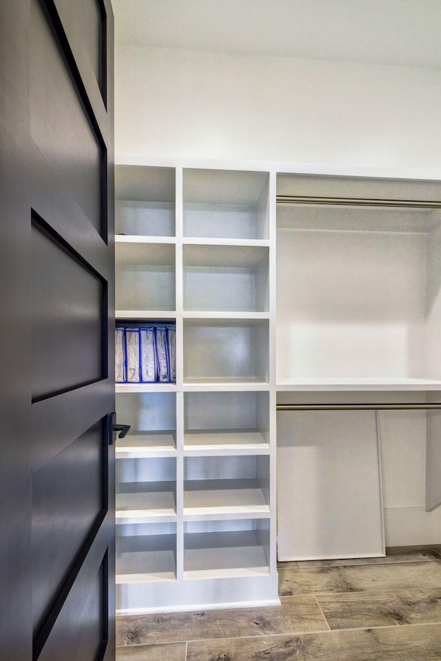 walk in closet featuring hardwood / wood-style floors