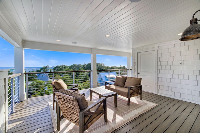 wooden terrace with outdoor lounge area