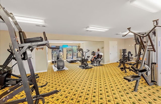 gym featuring light carpet