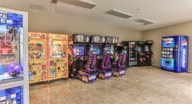 game room featuring light tile flooring